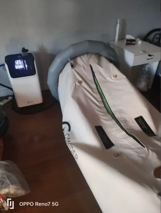Complete soft chamber and equipment setup beside a bed