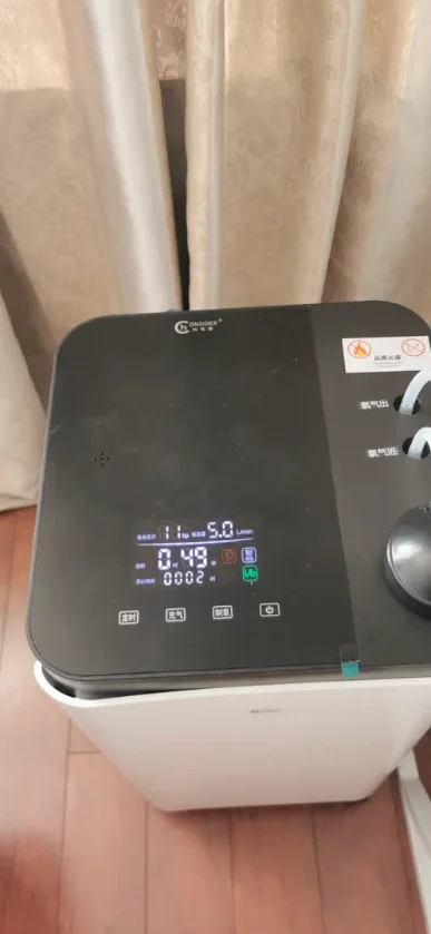 CONSIDER oxygen concentrator and control unit operating at home